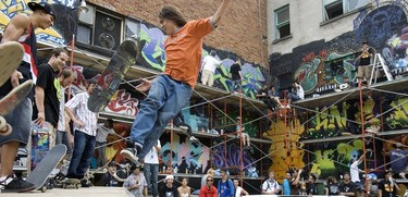 From the archives: Youths at the 2007 12th annual Under Pressure graffiti festival, some on skateboards, others spraypainting on scaffolding.