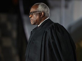 Supreme Court Associate Justice Clarence Thomas attends the ceremonial swearing-in ceremony for Amy Coney Barrett to be the U.S. Supreme Court Associate Justice on the South Lawn of the White House Oct. 26, 2020 in Washington, DC.