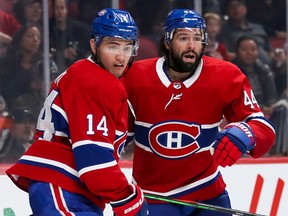 Canadiens' Nick Suzuki, left, and Nate Thompson in 2019.