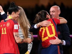 Spanish defender Rocio Galvez is congratulated by Spanish Football Federation president Luis Rubiales, right.