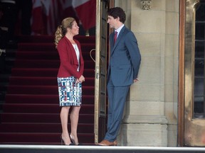 Sophie Gregoire Trudeau and justin trudeau in front of parliament