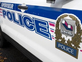 The Laval police logo is seen on a police car.