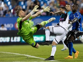 CF Montréal goalkeeper Jonathan Sirois (40) makes an acrobatic save against Minnesota United midfielder Franco Fragapane (7) in Montreal on June 10, 2023. “I'm super happy to extend my contract, to be able to continue playing at home in front of the fans, my family and my friends," Sirois said. "I always said to myself I wanted to play in the biggest leagues, but above all I want to reach my potential. I'm 22 so I still have a lot to learn and it's up to me to keep developing.”