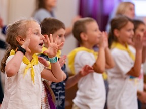 Children perform on stage