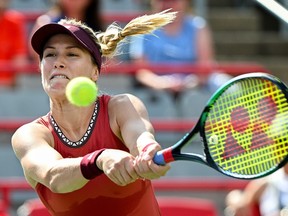 Eugenie Bouchard returns the ball to Danielle Collins, from the United States, during their qualifying match at the National Bank Open tennis tournament in Montreal, Saturday, Aug. 5, 2023.