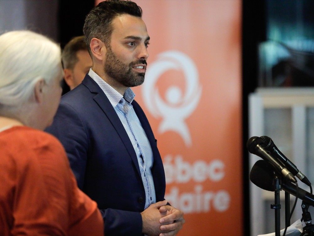 Québec solidaire candidate Olivier Bolduc speaks on stage after winning the party's nomination the next by-election in the riding of Jean-Talon at the Université Laval in Quebec City Aug. 6, 2023.