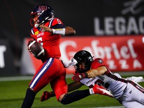 Montreal Alouettes quarterback Caleb Evans (5) runs his way to a game-winning touchdown against the Redblacks during second half CFL football action in Ottawa on Saturday, Aug. 19, 2023.