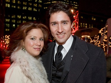 Sophie Grégoire Trudeau and Justin Trudeau pose for the camera in formal wear outside