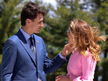 Justin Trudeau and Sophie Grégoire Trudeau look at each other and smile