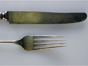 a fork and knife against a white background