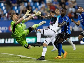 CF Montreal goalkeeper Jonathan Sirois makes a save against Minnesota United midfielder Franco Fragapane during second half MLS soccer action in Montreal, Saturday, June 10, 2023. CF Montreal has signed Sirois to a three-year extension through the 2026 season, the club announced Tuesday.