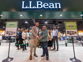 St-Bruno mayor Ludovic Grisé Farand and store manager Sophie Charles cut the ribbon at the opening of the first L.L. Bean store in Quebec in the Promenades St-Bruno, south of Montreal, Friday Aug. 25, 2023.