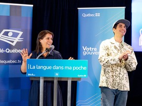 Anaïs Favron, left, and Mike Clay behind a podium during a news conference