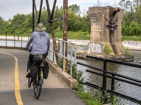 Cyclist on a bike path next to a canal