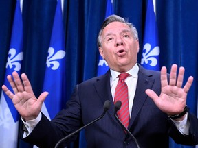 Quebec Premier Francois Legault responds to reporters questions at a news conference before question period, at the legislature in Quebec City.