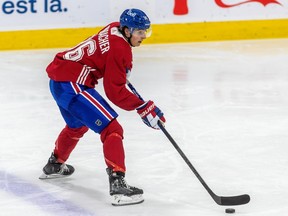 Montreal Canadiens top prospect David Reinbacher, in red, skates during the Habs' development camp this summer.