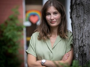 Portrait of Sophie Gagnon in a green shirt, with her arms crossed.