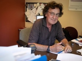 Stephan Reichhold poses for a photo at his desk