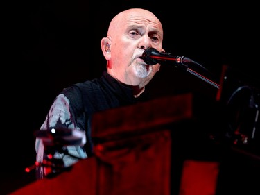 Closeup of Peter Gabriel singing into a microphone