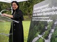 Montreal Mayor Valérie Plante stands at a podium at Mount Royal Park during a news conference.