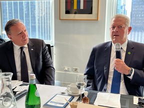 François Legault listens to Al Gore speak at a climate meeting in New York City.