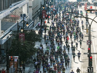 People run north on Berri St. during the Montreal Marathon on Sunday, Sept. 24, 2023. The marathon returned for first time since 2019.
