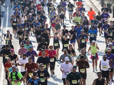 People take part in the Montreal Marathon on Sunday, Sept. 24, 2023.