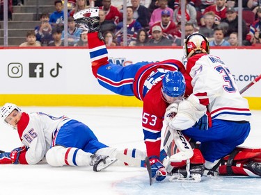 Forward Jan Mysak crashes into goalie Quentin Miller after tripping over defenceman Tobie Bisson during the Canadiens annual Red & White intrasquad game in Montreal on Sunday, Sept. 24, 2023.