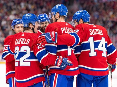 Canadiens' Cole Caufield celebrates his goal with teammates Tanner Pearson, Nick Suzuki, Miguel Tourigny, rear left, and Jayden Struble during the team's annual Red & White intrasquad game in Montreal on Sunday, Sept. 24, 2023.