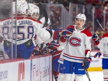 Florian Xhekaj gets high-fives from team-mates on the bench after scoring a goal during the Canadiens annual Red & White intrasquad game in Montreal on Sunday, Sept. 24, 2023.