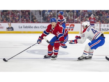 Canadiens' Emil Henieman holds off the check by Rafael Harvey-Pinard during the first period of the team's annual Red & White intrasquad game in Montreal on Sunday, Sept. 24, 2023.