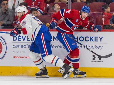 Forward Jared Davidson, right, slips past defenceman David Savard along the boards during the Canadiens annual Red & White intrasquad game in Montreal on Sunday, Sept. 24, 2023.