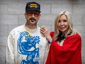 AJ McLean and Caroline Bernir, a man and a woman, are posing looking directly at a camera in this portrait shot.