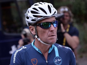 US cyclist Lance Armstrong gets ready in Rodez, southwest France, prior to ride a stage of The Tour De France for a leukaemia charity
