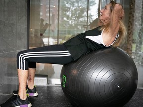 Maria Levitt, 86, on an exercise ball, doing situps.
