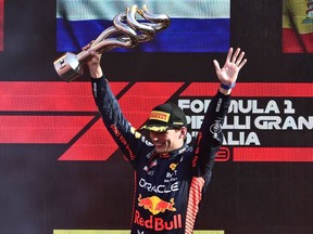 Red Bull Racing's Dutch driver Max Verstappen celebrates with his first-place trophy on the podium after the Italian Formula One Grand Prix race at Autodromo Nazionale Monza circuit, in Monza on Sunday, Sept. 3, 2023.