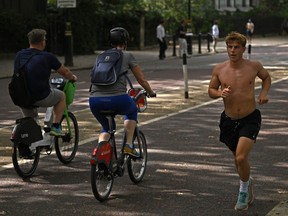 People exercise in central London on September 6, 2023 as the late summer heatwave continues.