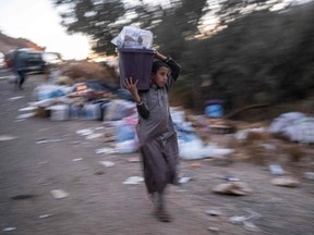 A boy makes his way to his village in the mountainous area of Tizi N'Test, in the Taroudant province, one of the most devastated in quake-hit Morocco.