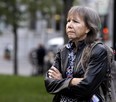 Indigenous rights advocate Ellen Gabriel crosses her arms at an outdoor ceremony.