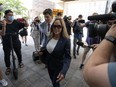 Lawyer Lawrence Greenspon walks with Tamara Lich in to the courthouse on the first day of trial, in Ottawa, Tuesday, Sept. 5, 2023. The lawyers involved in the case of two prominent "Freedom Convoy" organizers are working to keep the court from coming to a complete standstill as the trial enters its third week.