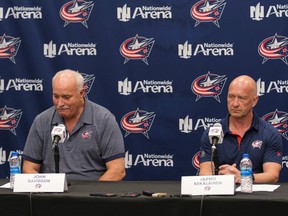 Blue Jackets president John Davison, left, and general manager Jarmo Kekalainen sit behind a table at Nationwide Arena in Columbus.