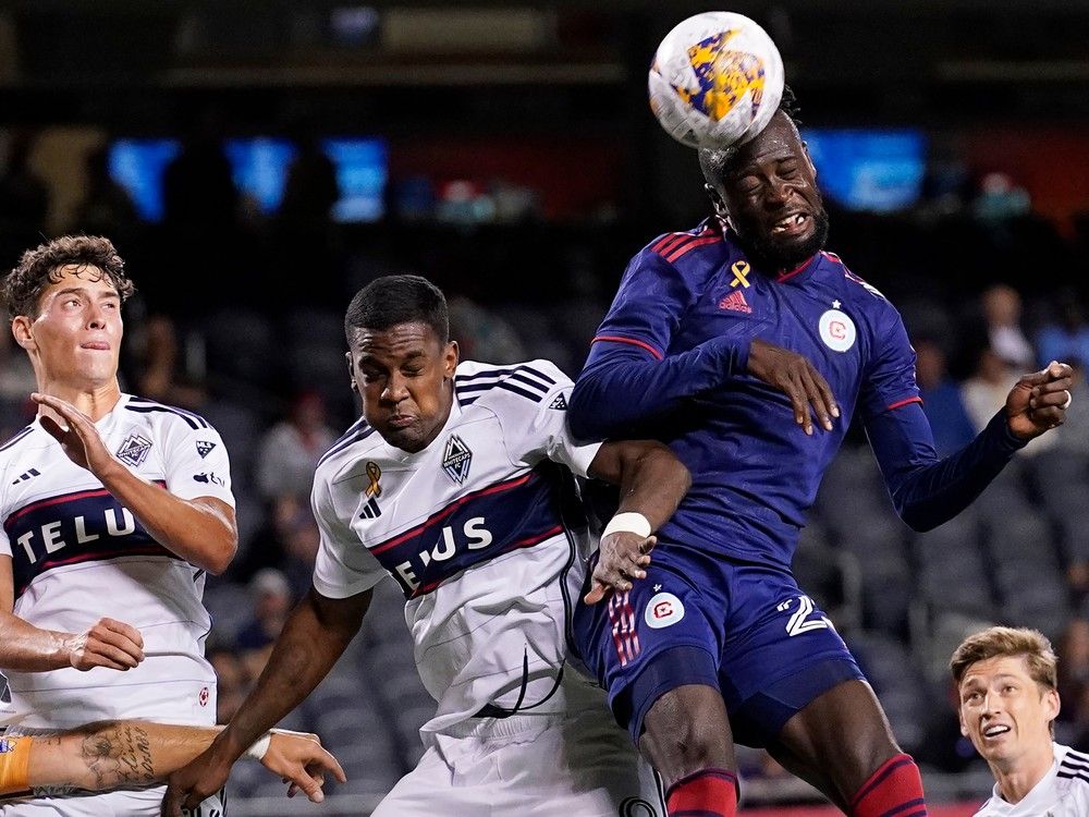 Chicago Fire forward Kei Kamara, right, heads the ball next to Whitecaps midfielder Sebastian Berhalter, left, and forward Sergio C&oacute;rdova during a game in CHicago last month.