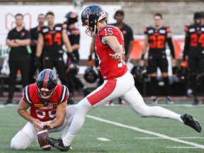 Alouettes kicker David Côté, right, kicks a field goal during first half CFL football action against the B.C. Lions in Montreal on Saturday, Sept. 2, 2023.