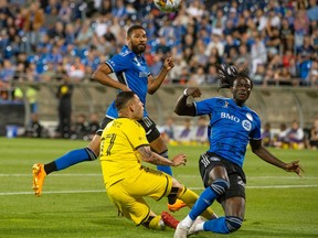 CF Montréal's Ousman Jabang, right, battles with Columbus Crew's Christian Ramirez during first half MLS soccer action in Montreal on Saturday, Sept. 2, 2023.