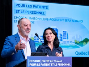 Christian Dubé and Valérie Plante smile behind a podium at a news conference