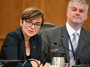 Christine Fréchette speaks into a microphone during a committee hearing