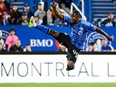 CF Montréal's Kwadwo Opoku jumps for the ball against FC Cincinnati in Montreal on Sept. 20, 2023.