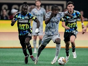 CF Montréal midfielder Kwadwo Opoku (90) moves the ball against Atlanta United during the second half of a MLS soccer match on Saturday, Sept. 23, 2023, in Atlanta.