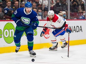 Canucks forward Tanner Pearson skates away from Canadiens defenceman Jeff Petry during a game at Rogers Arena in 2022.