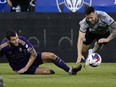 Orlando City SC defender Kyle Smith, left, and CF Montréal defender Aaron Herrera collide during first half MLS action in Montreal on Saturday, May 6, 2023. A rare road victory against Orlando City SC on Saturday, Sept. 30, 2023, could go a long way in securing a playoff spot for Montreal.